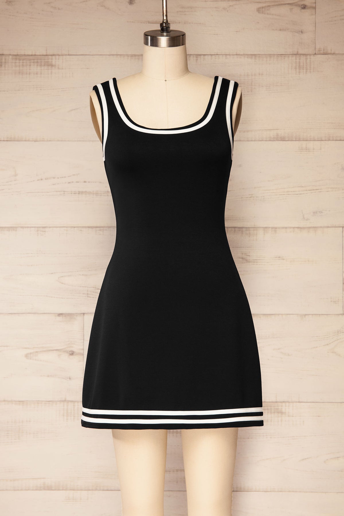 front view of Batala Black Contrast Trim Mini Dress with Built-In Shorts at La petite garçonne