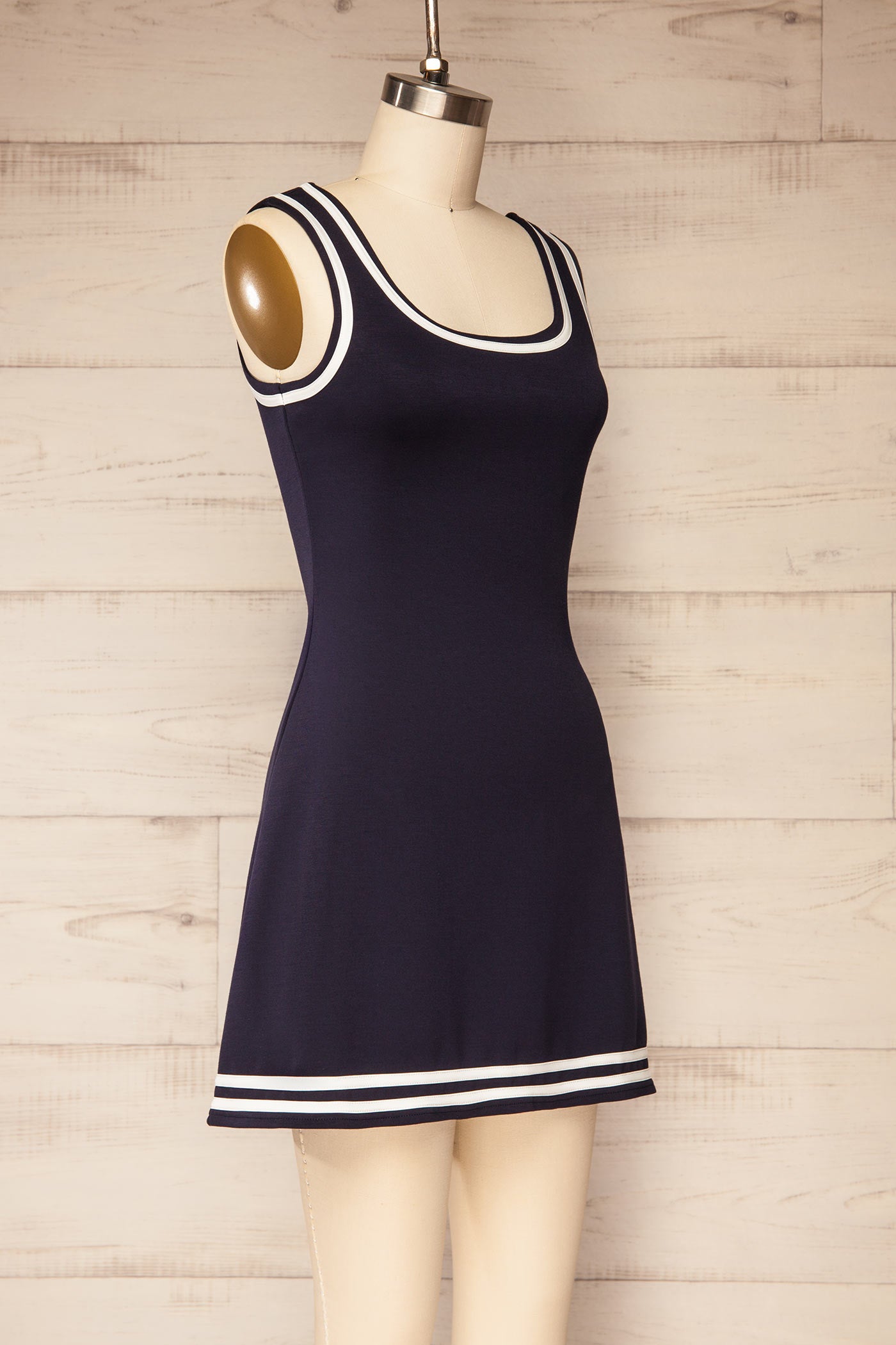 Profile view Batala Navy Contrast Trim Mini Dress with Built-In Shorts at la petite garçonne