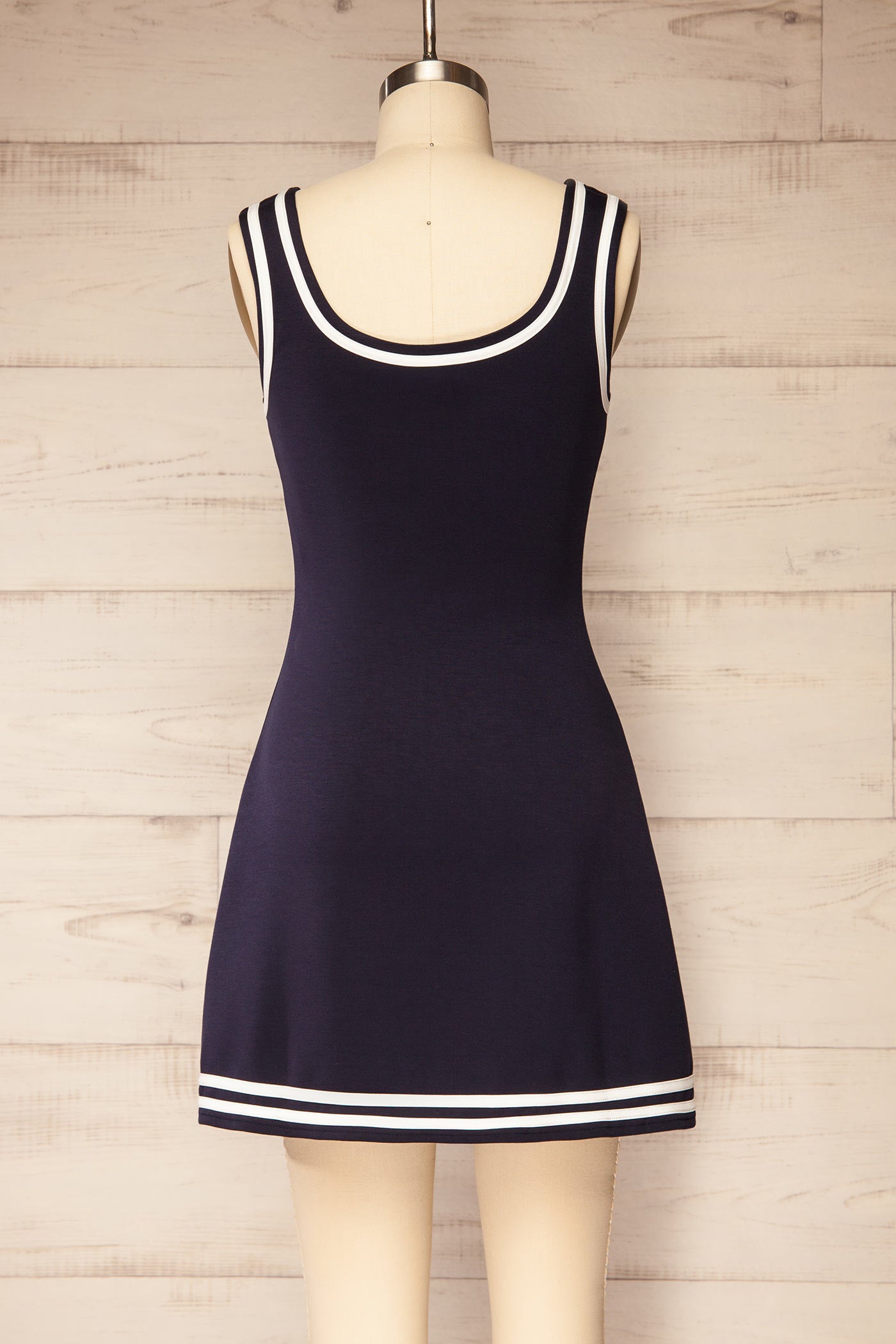 Back view Batala Navy Contrast Trim Mini Dress with Built-In Shorts at la petite garçonne