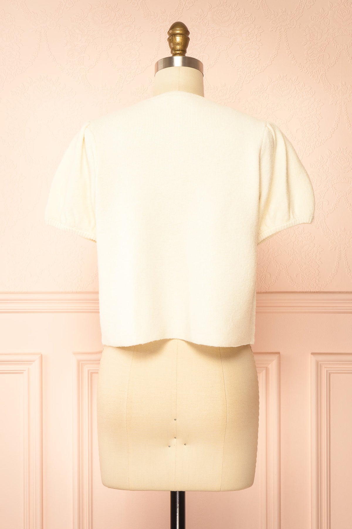 back view of Belza Ivory Short Sleeve Puff Sleeve Cropped Knit Cardigan at Boutique 1861