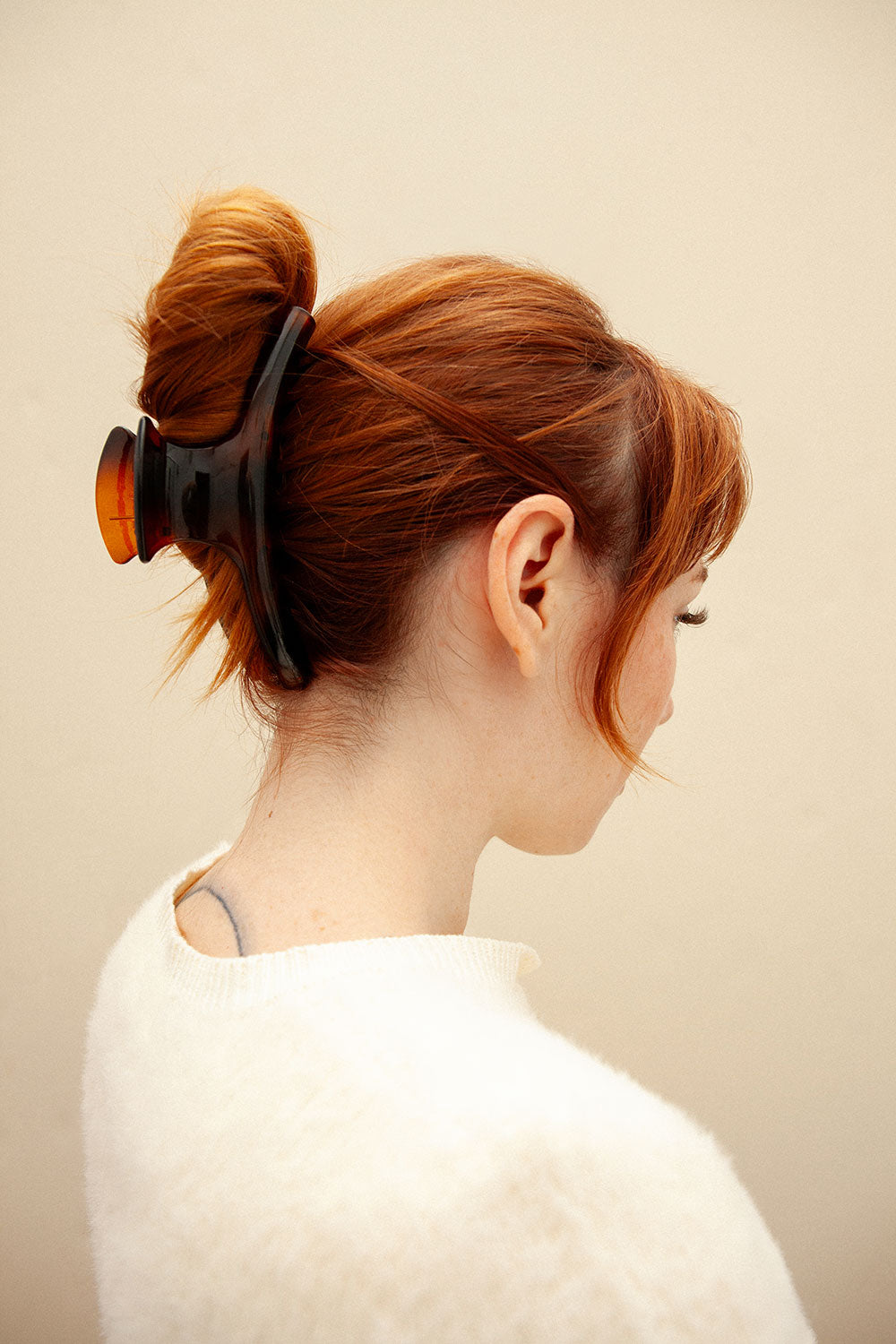 woman wearing A large hair clip named Biscuit Tortoise 