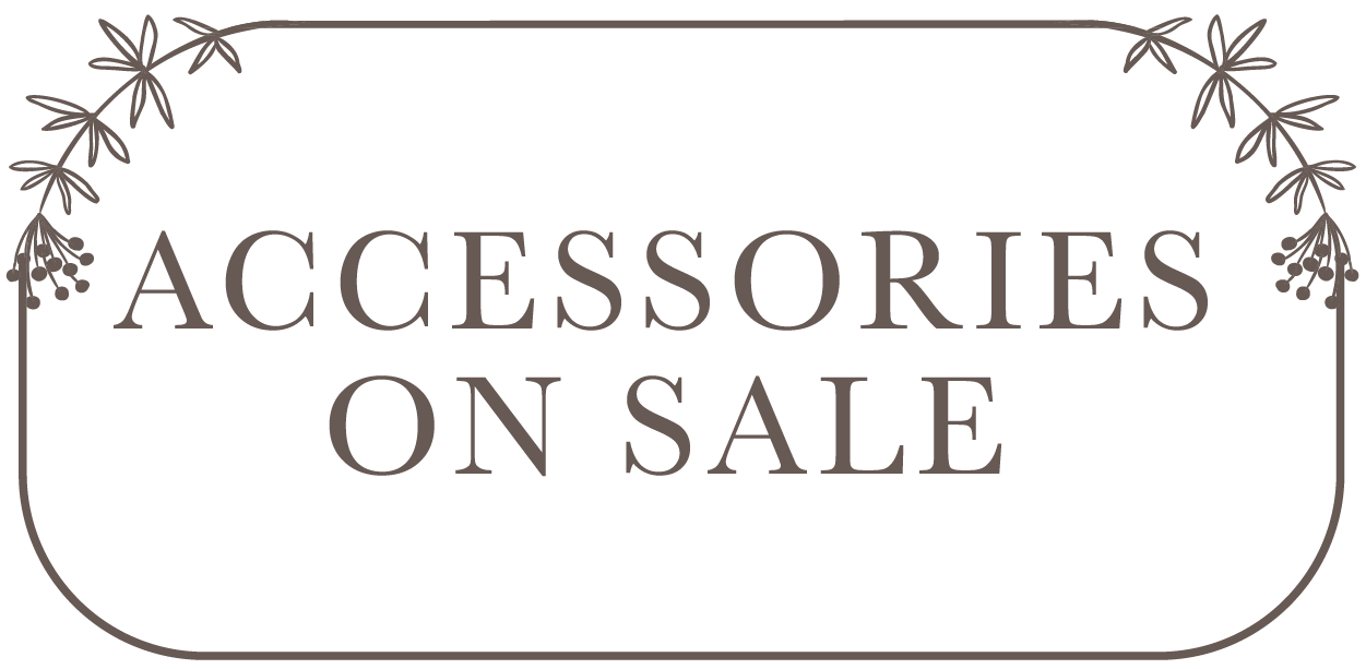Decorative sign with 'Accessories on Sale' text and floral elements.