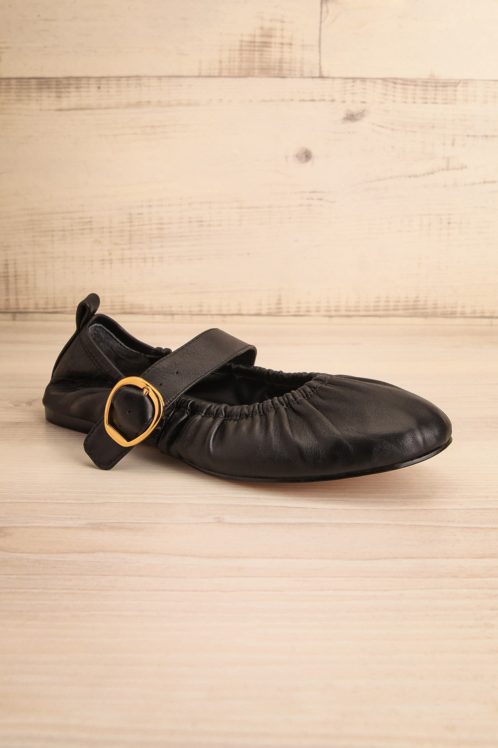 Caelie Black Leather Ballet Flats with Gold Buckle | La petite garçonne side view