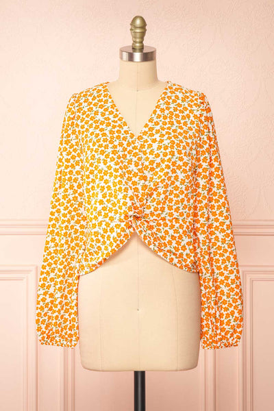 Calantra Faux Wrap Blouse w/ Orange Floral Motif | Boutique 1861 front view