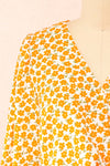 Calantra Faux Wrap Blouse w/ Orange Floral Motif | Boutique 1861  front close-up