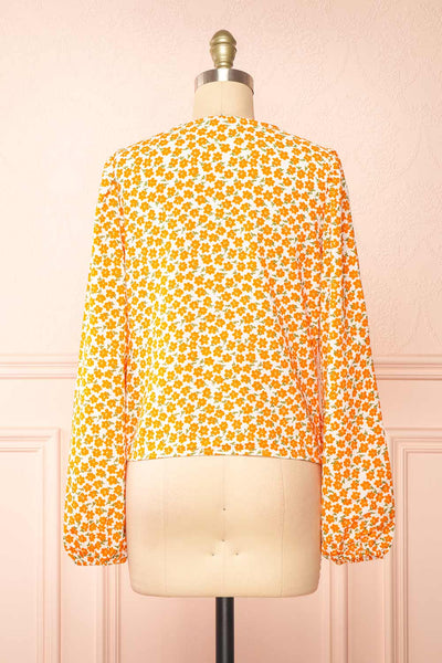 Calantra Faux Wrap Blouse w/ Orange Floral Motif | Boutique 1861  back view