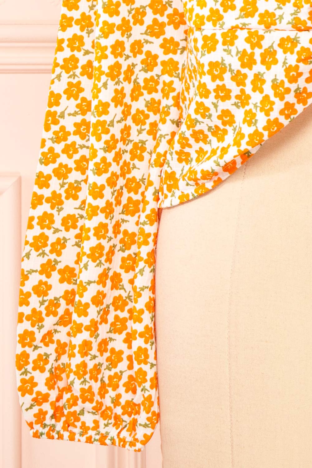 Calantra Faux Wrap Blouse w/ Orange Floral Motif | Boutique 1861  bottom