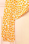 Calantra Faux Wrap Blouse w/ Orange Floral Motif | Boutique 1861  bottom