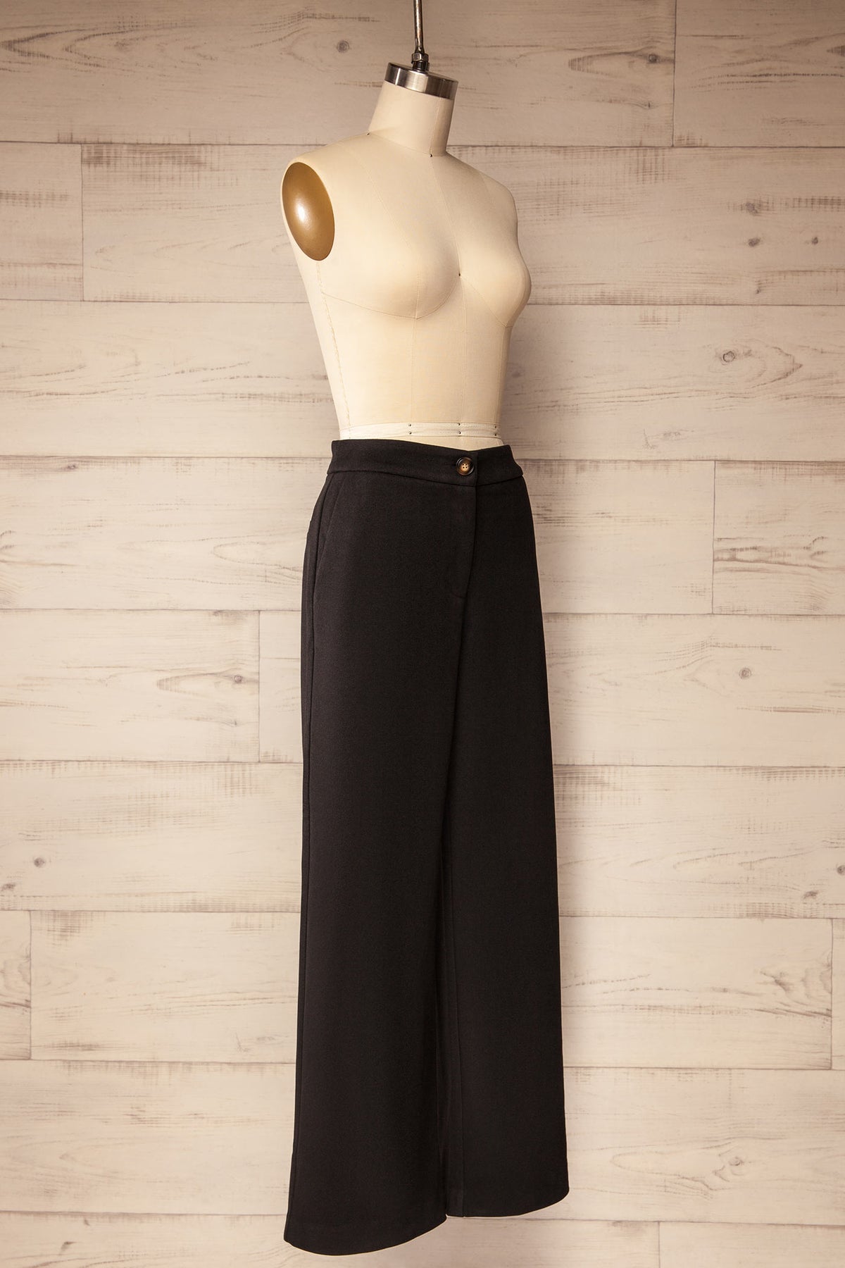 side view of Cascapedia Black Wide-Leg Full-Length Pants with Pockets at La petite garçonne