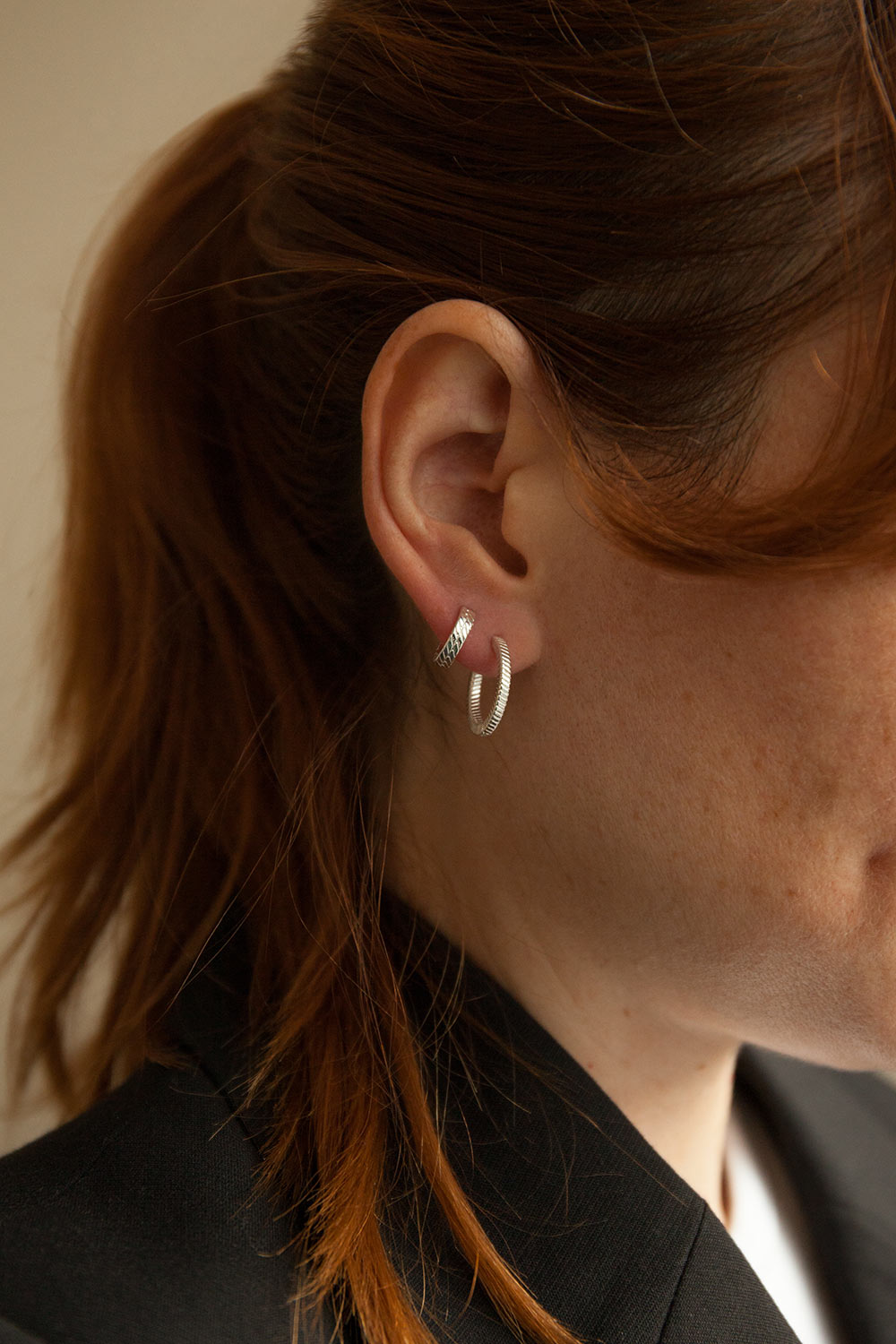 Cavalier Silver Hoop Earrings w/ Herringbone Pattern model