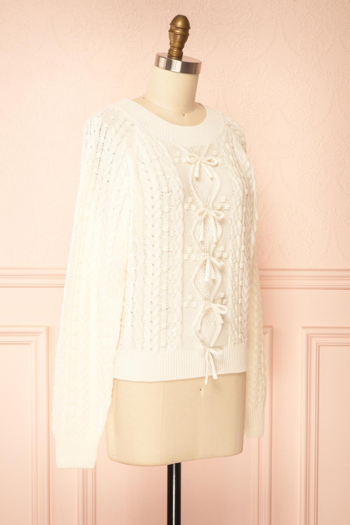 side view of Celesia Ivory Knit Sweater with Bows at Boutique 1861