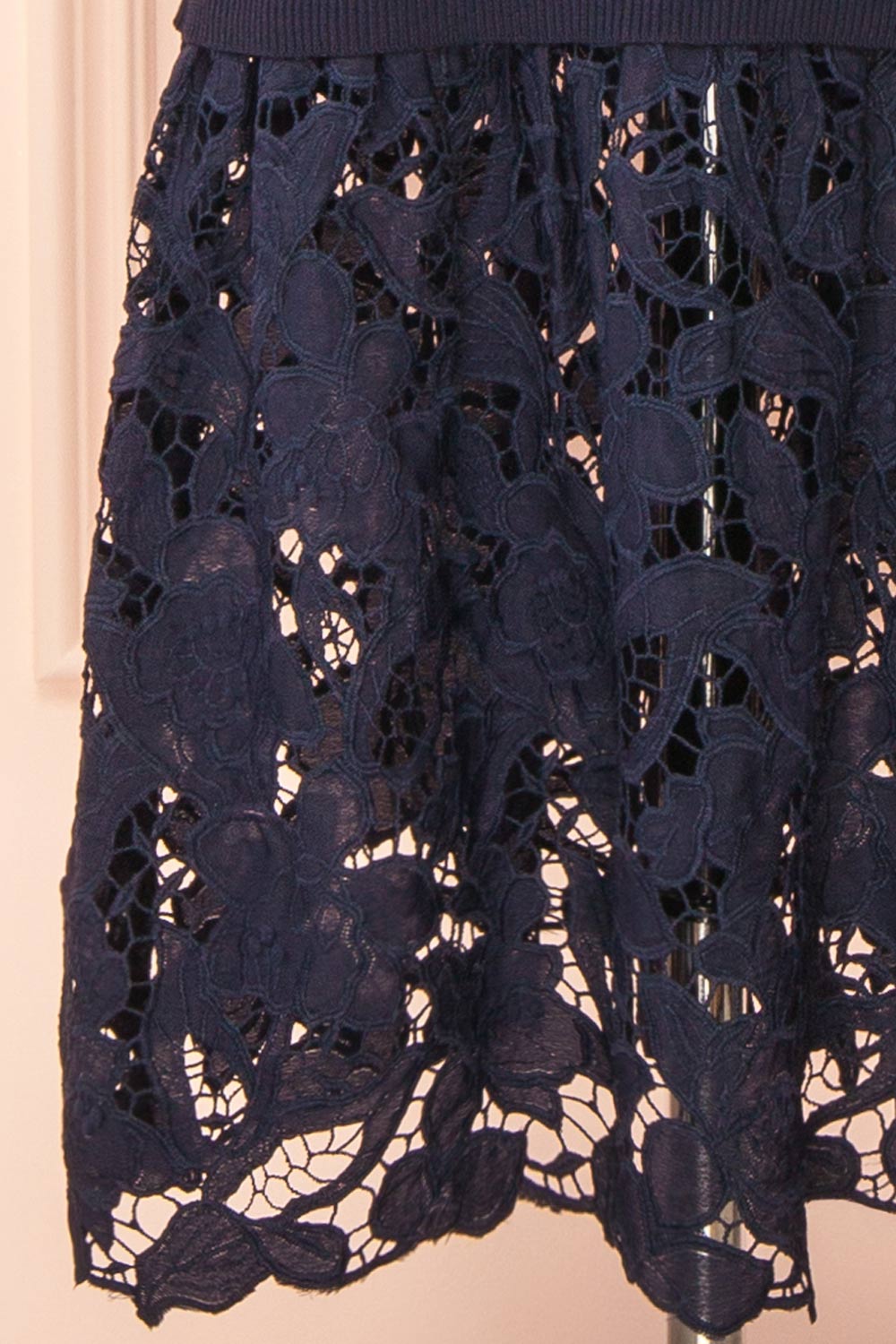 bottom of sewing mannequin wearing Christie Sleeveless Navy Midi Dress with Lace from Boutique 1861