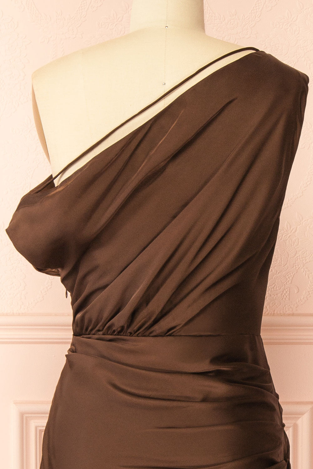  back front view of mannequin wearing Colleen Brown Asymmetrical Satin Dress from boutique 1861