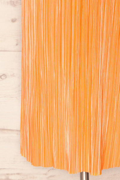 Cordoba Orange Pleated Midi Dress | La petite garçonne bottom view
