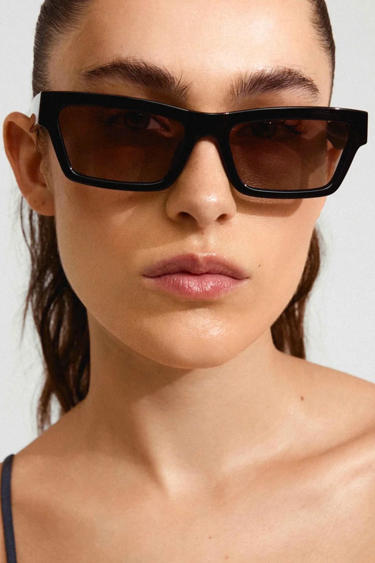 woman wearing Crema Black Rectangle Frame Sunglasses by Pilgrim from La petite garçonne