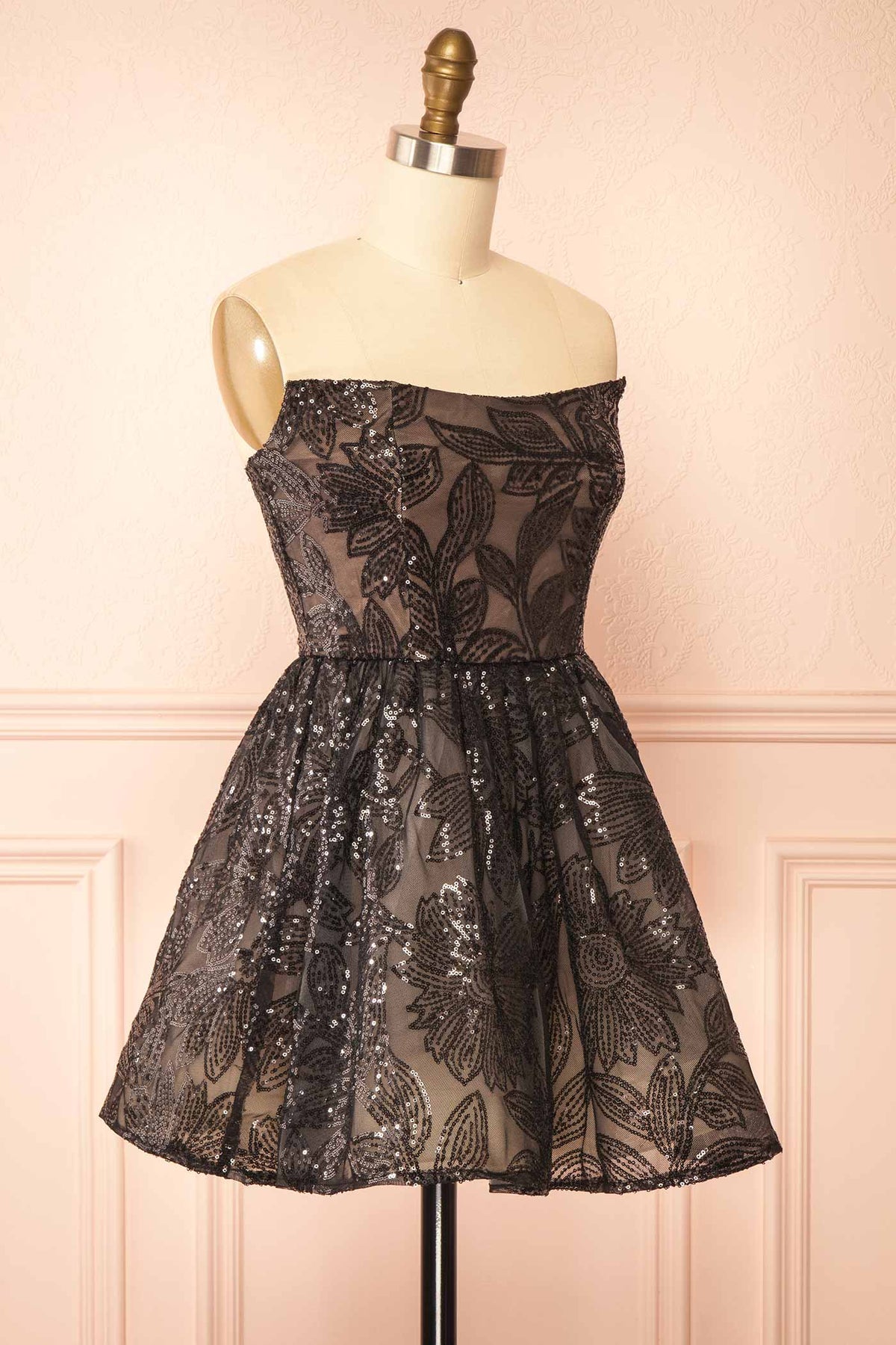 Side view of Daina Black Strapless Sequin Floral Embroidered Mini Dress at Boutique 1861 
