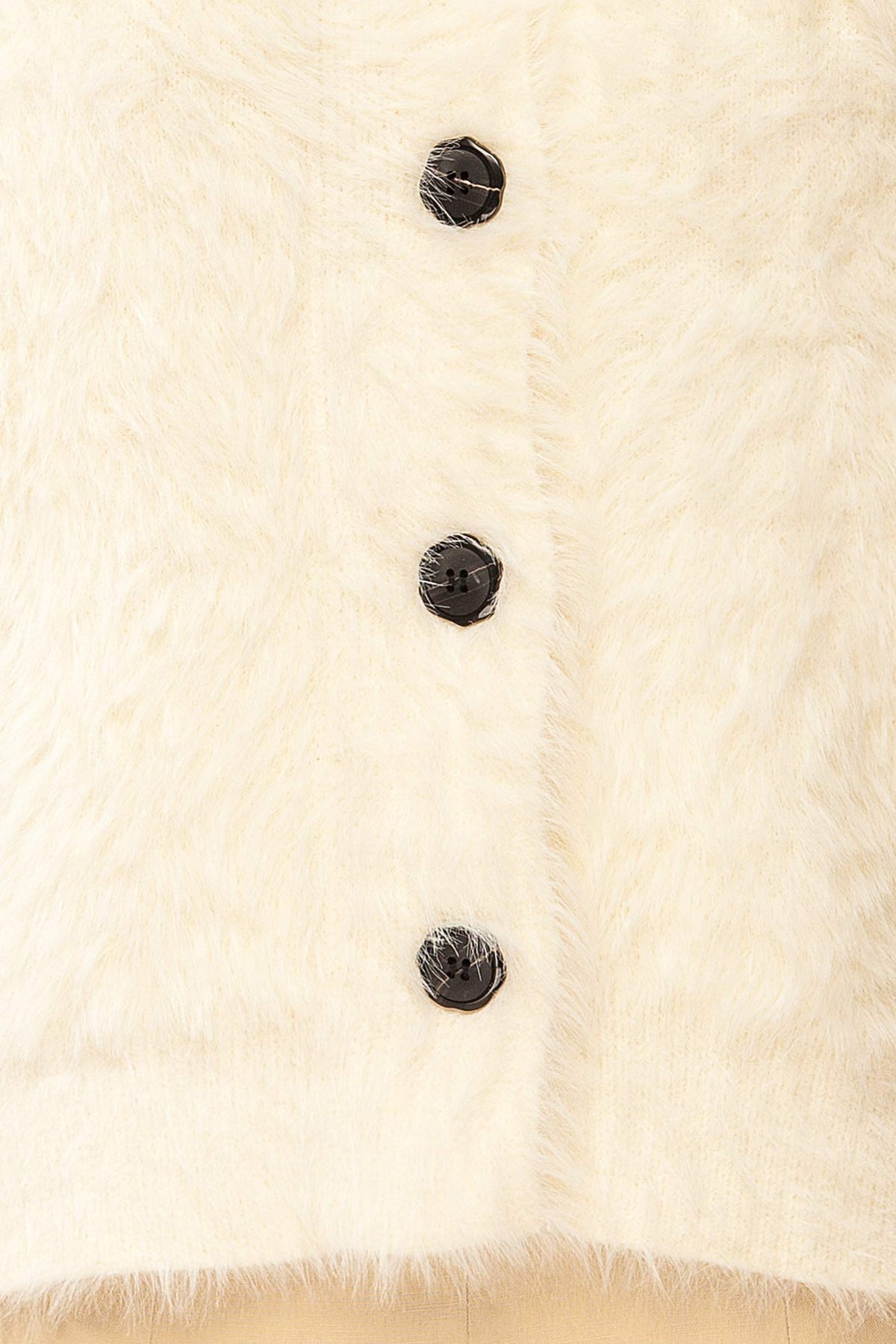 fabric view of Dassylva Ivory Fluffy Cardigan with Contrast Buttons at La petite garçonne 