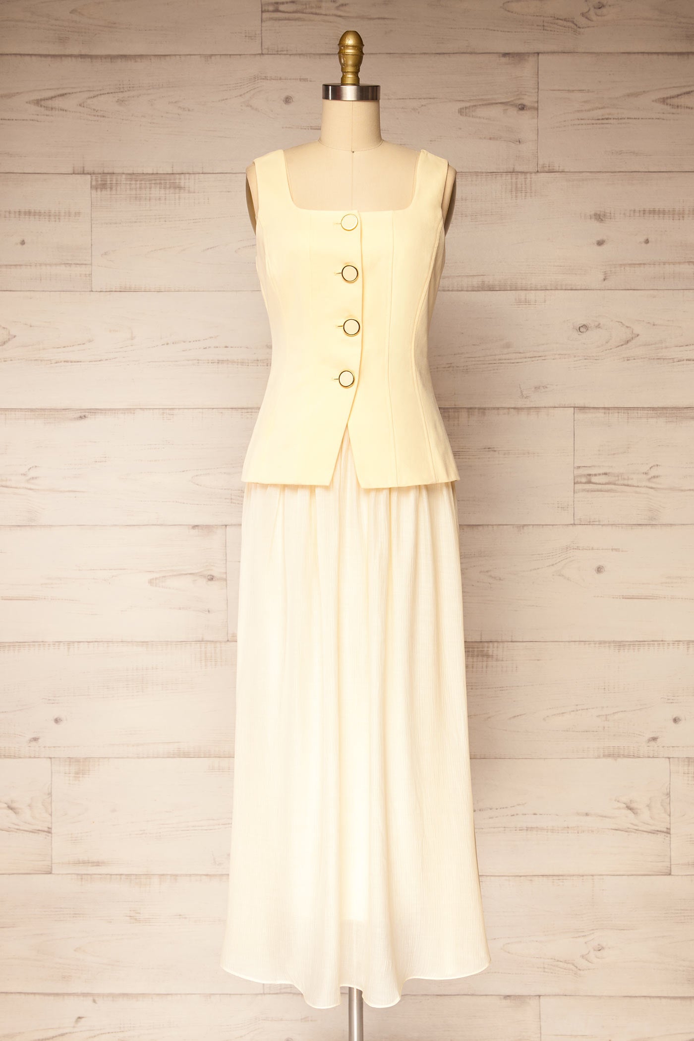 Front view Dhule Light Yellow Sleeveless Contrast Maxi Dress with Button at la petite garçonne