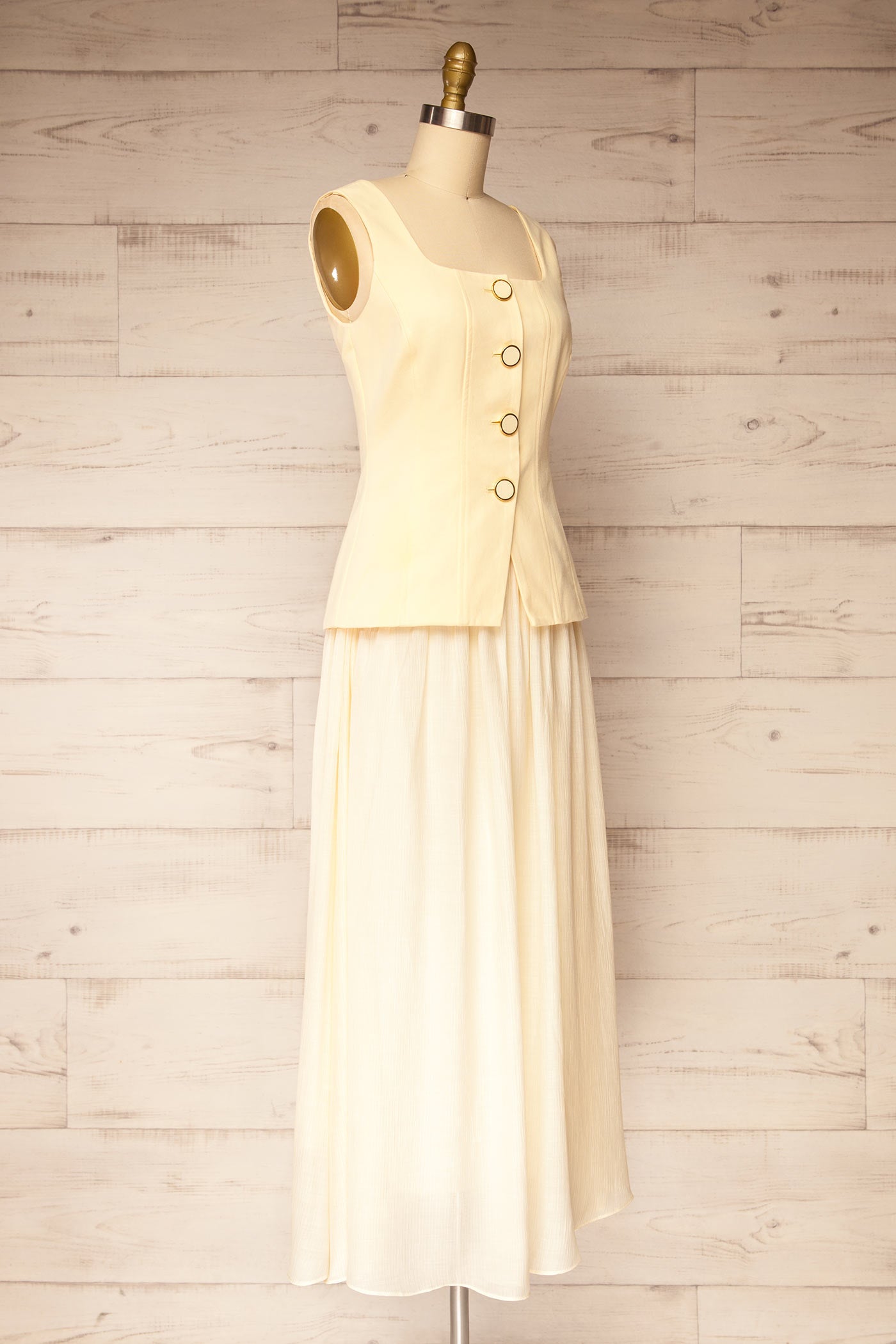 Profile view Dhule Light Yellow Sleeveless Contrast Maxi Dress with Button at la petite garçonne
