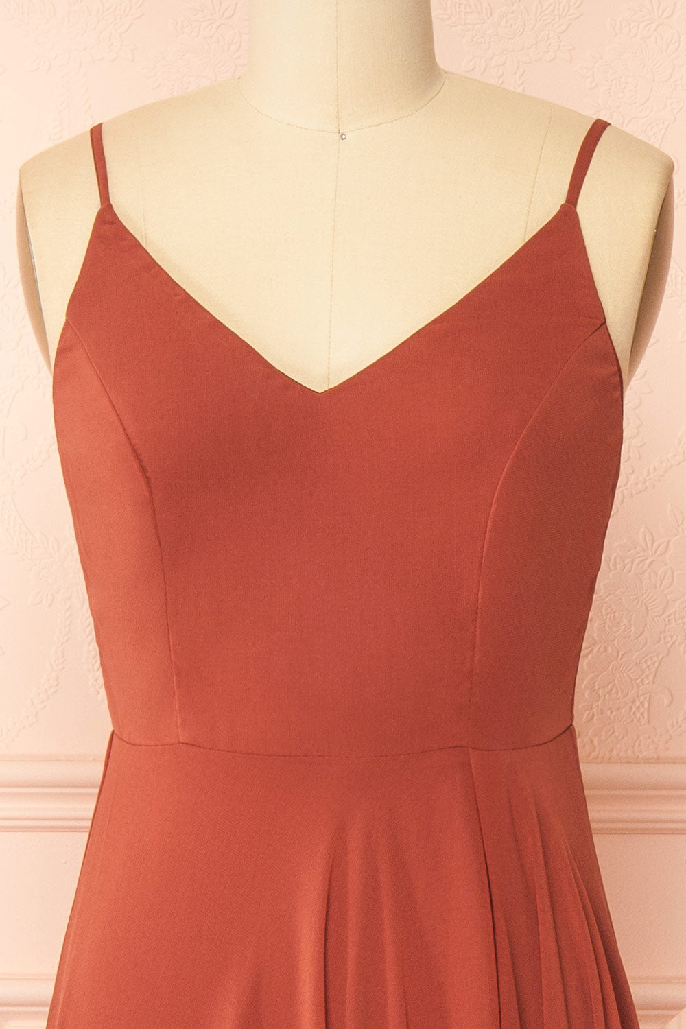 front of a mannequin wearing Diana Rust Exclusive 1861 A-Line Chiffon Dress with Slit | Boutique 1861