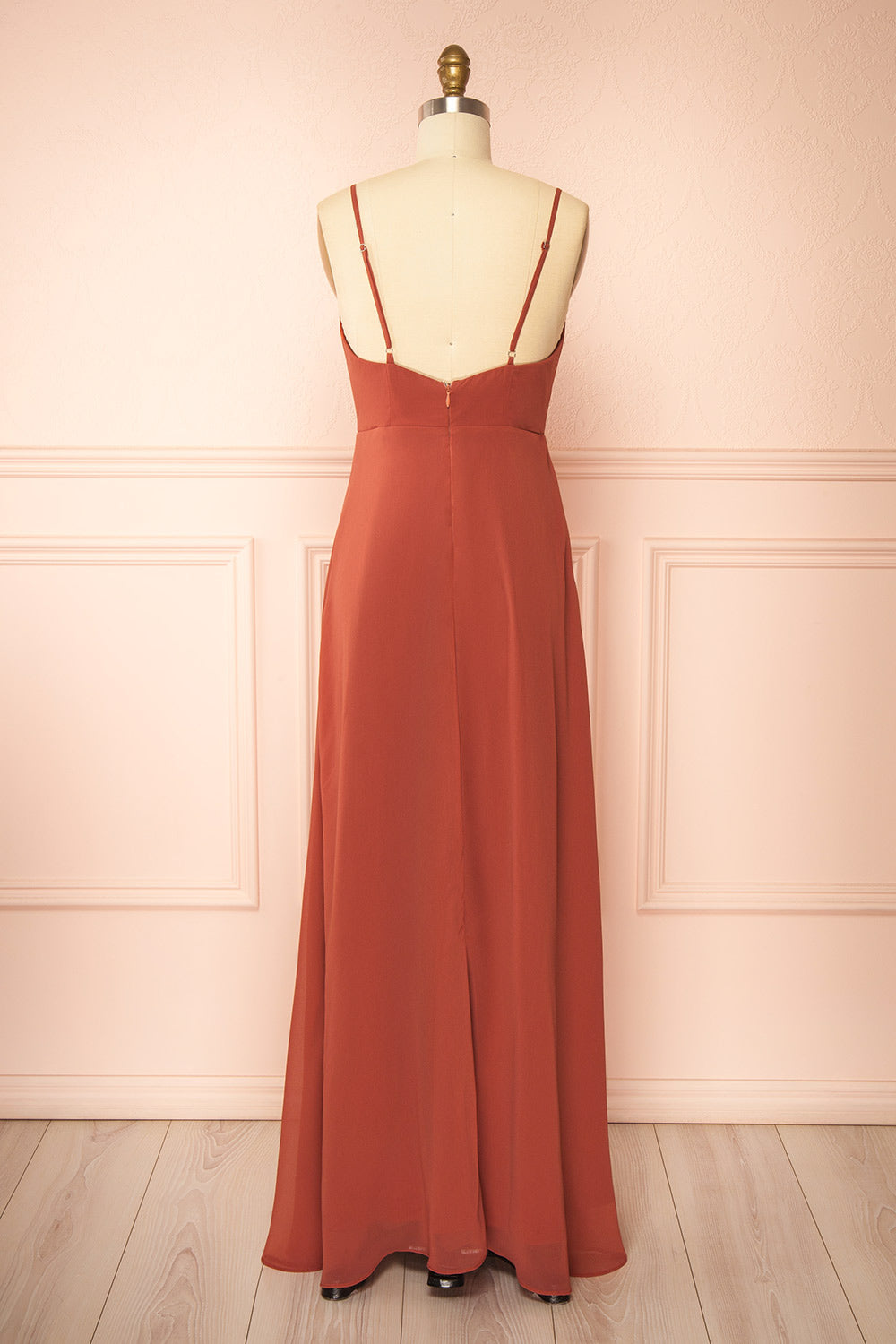 back view of a mannequin wearing Diana Rust Exclusive 1861 A-Line Chiffon Dress with Slit | Boutique 1861