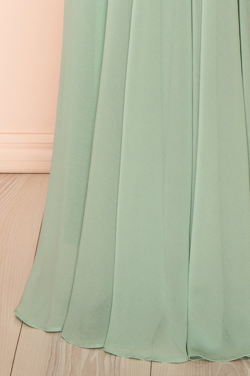 bottom of a mannequin wearing Diana Rust Exclusive 1861 A-Line Chiffon Dress with Slit | Boutique 1861