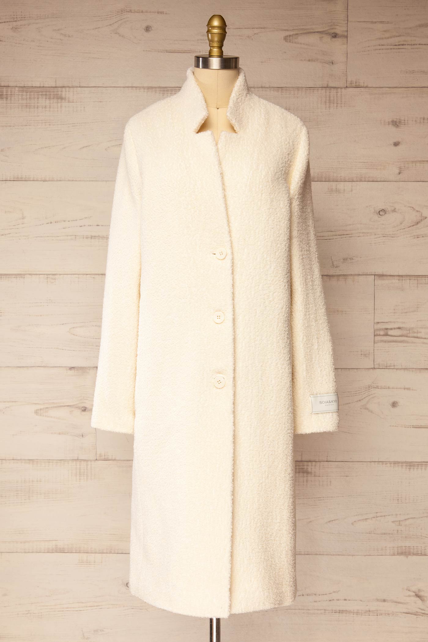 front view of Diane Ivory Curly Wool Coat with Pockets at La petite garçonne