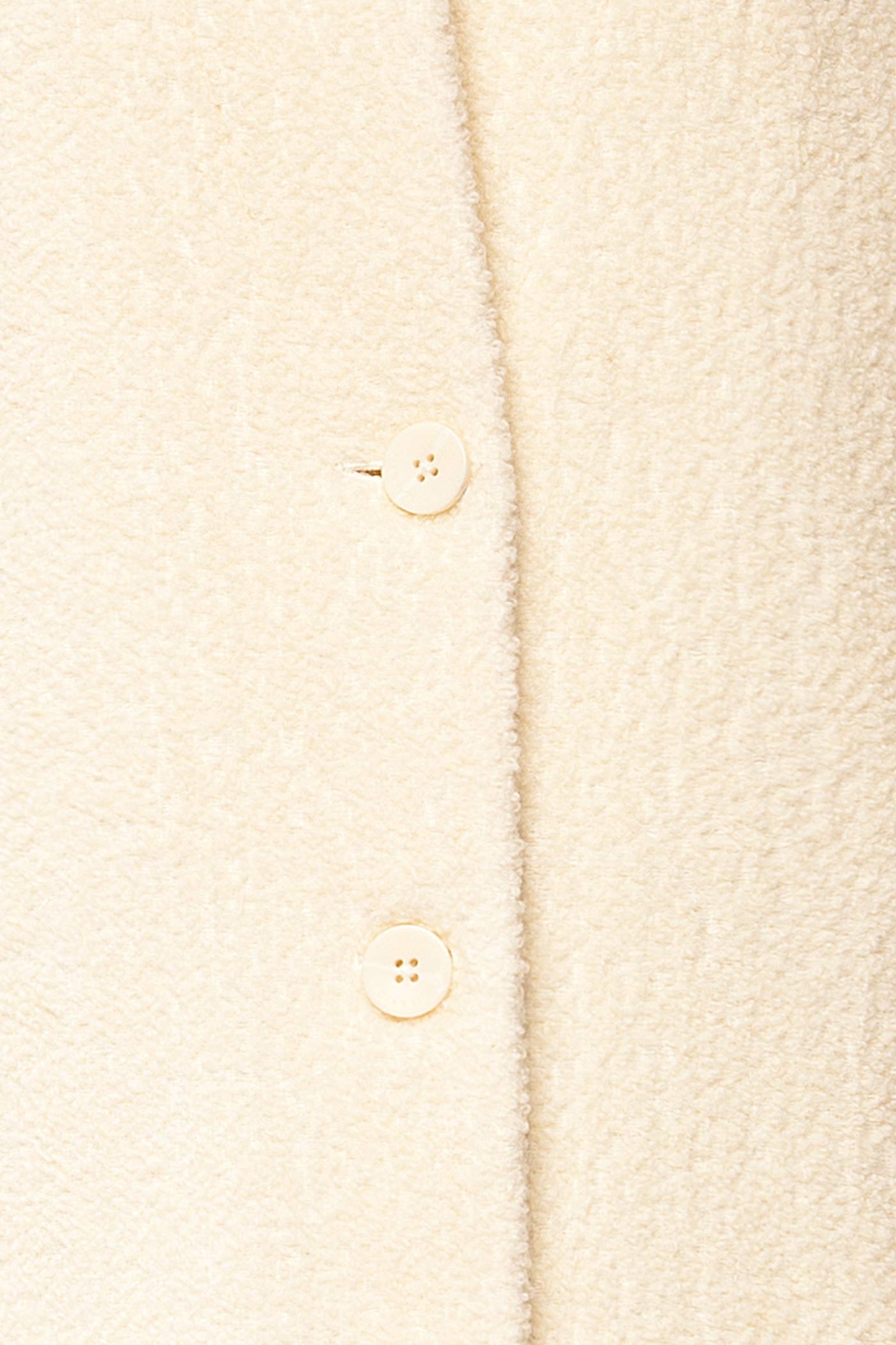 fabric view of Diane Ivory Curly Wool Coat with Pockets at La petite garçonne