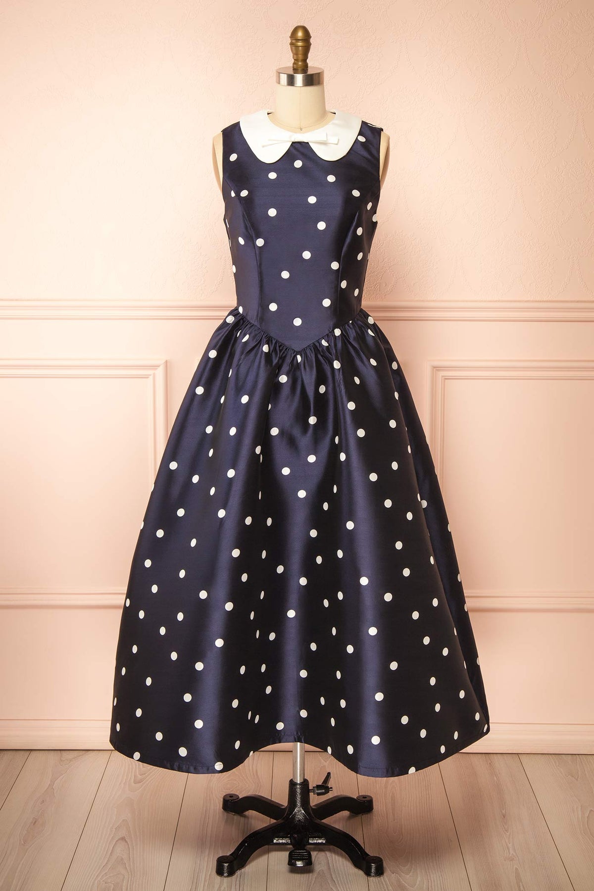 front view of Dollie Midi Navy Polka Dot Dress with Peter Pan Collar at Boutique 1861