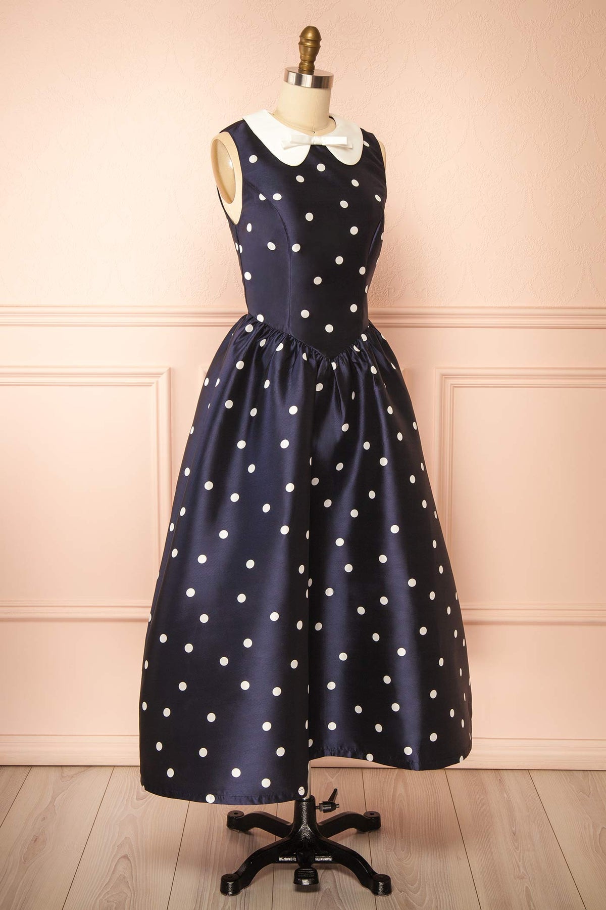 side view of Dollie Midi Navy Polka Dot Dress with Peter Pan Collar at Boutique 1861 
