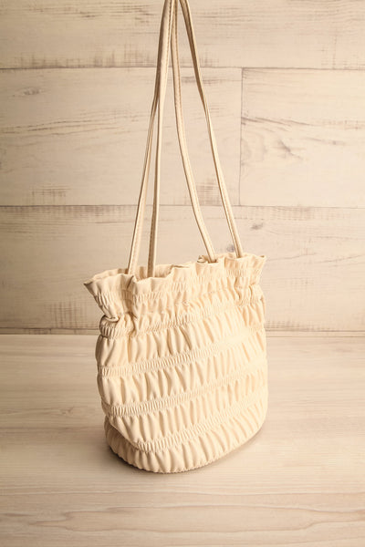 Duroque Ivory Drawstring Shoulder Bag | La petite garçonne side view