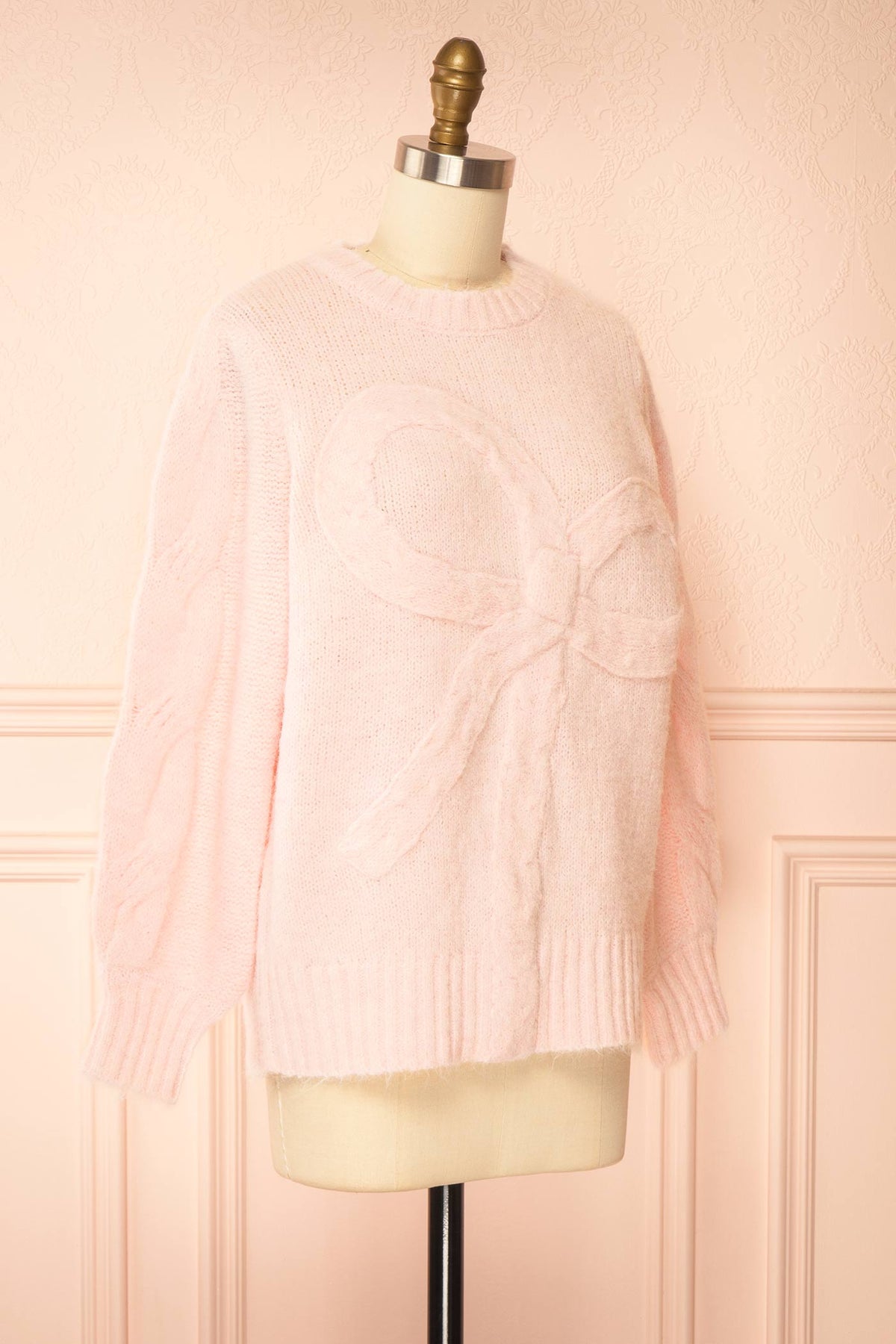 side view of Edelmina Pink Knit Sweater with Bow at Boutique 1861