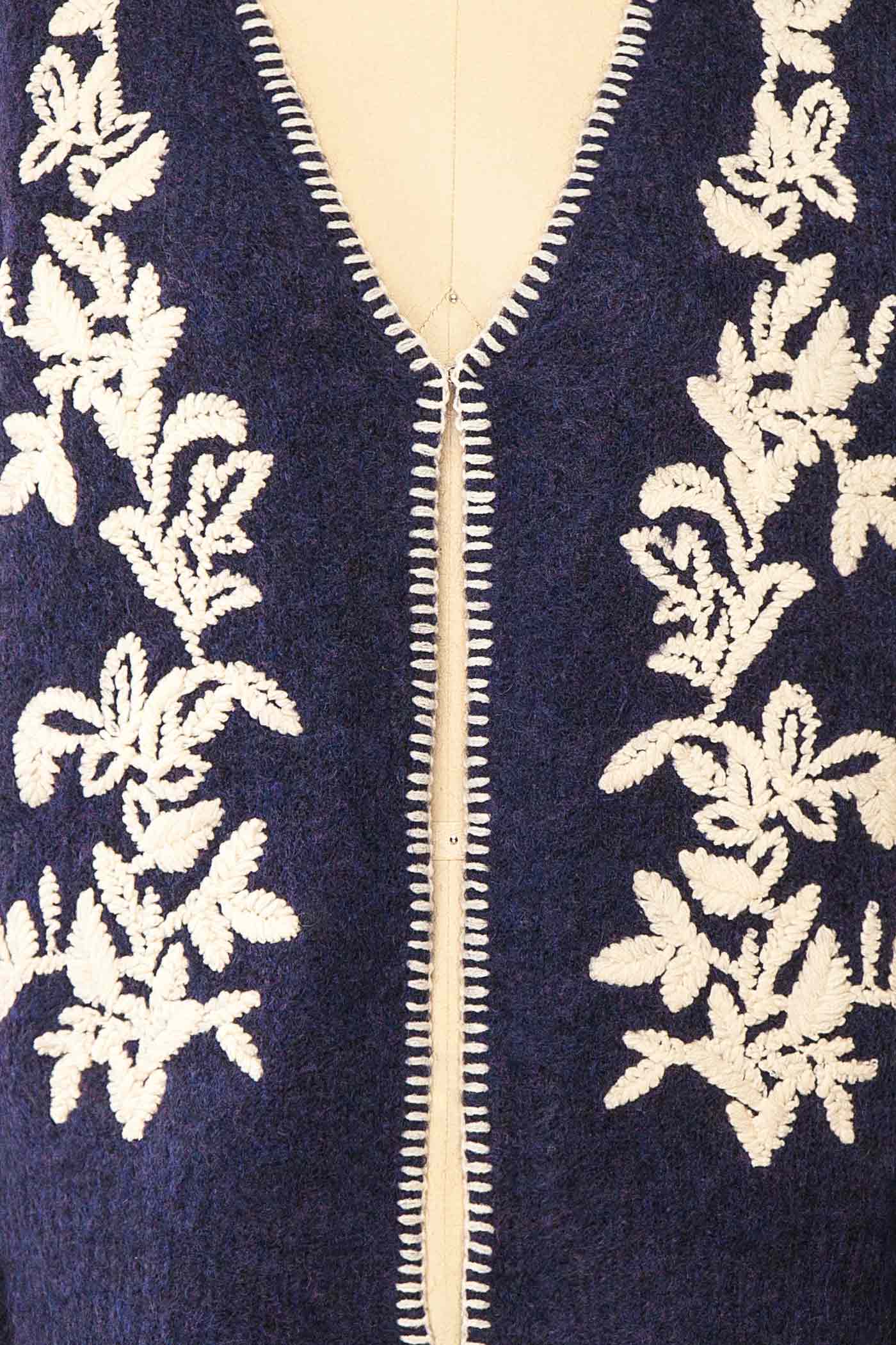 fabric view of Edulia Navy Knit Cardigan with Floral Embroidery at La petite garçonne