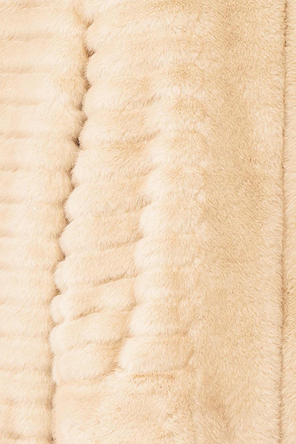 fabric view of Elbea Ivory Faux-Fur Ribbed Jacket with Pockets at Boutique 1861