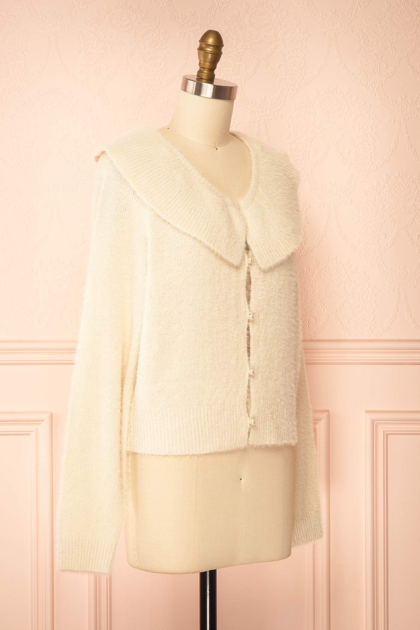 side view of Eliada Beige Knit Cardigan with Pearl Buttons at Boutique 1861