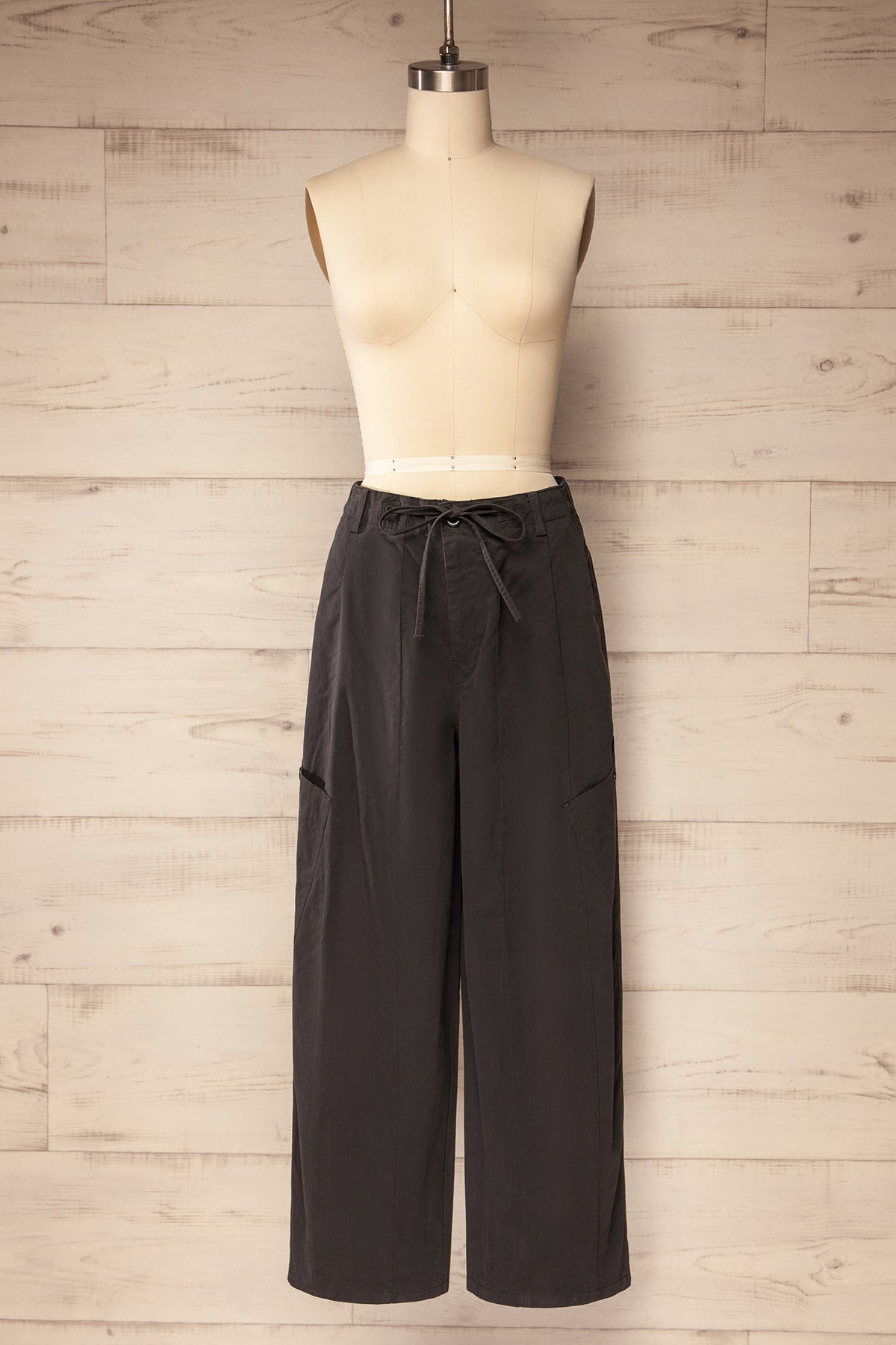 front view of Esker Dark Grey Barrel Leg Cargo Pants with Drawstring at La petite garçonne