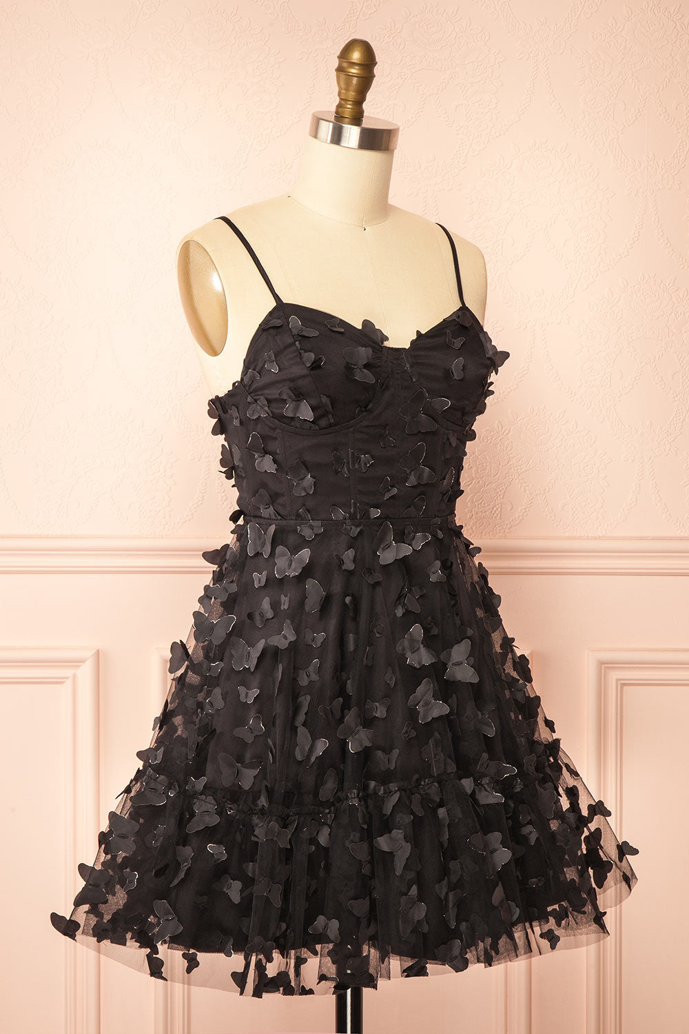side view of sewing Mannequin wearing Faya Black Short Corset Dress with Butterflies From Boutique 1861
