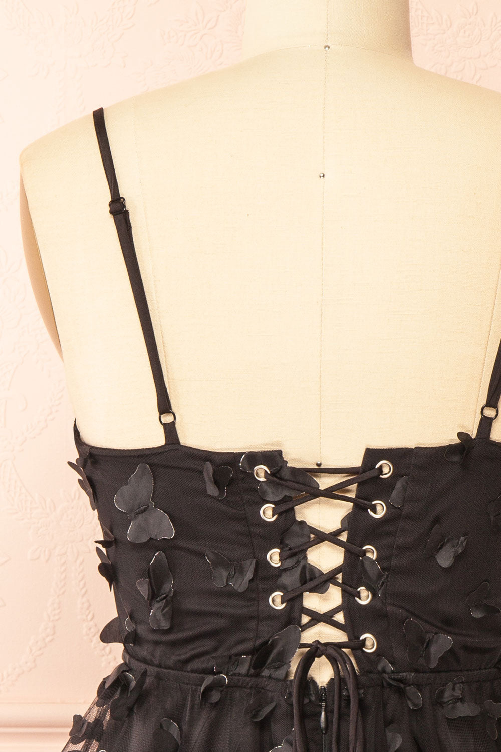 back of sewing Mannequin wearing Faya Black Short Corset Dress with Butterflies From Boutique 1861