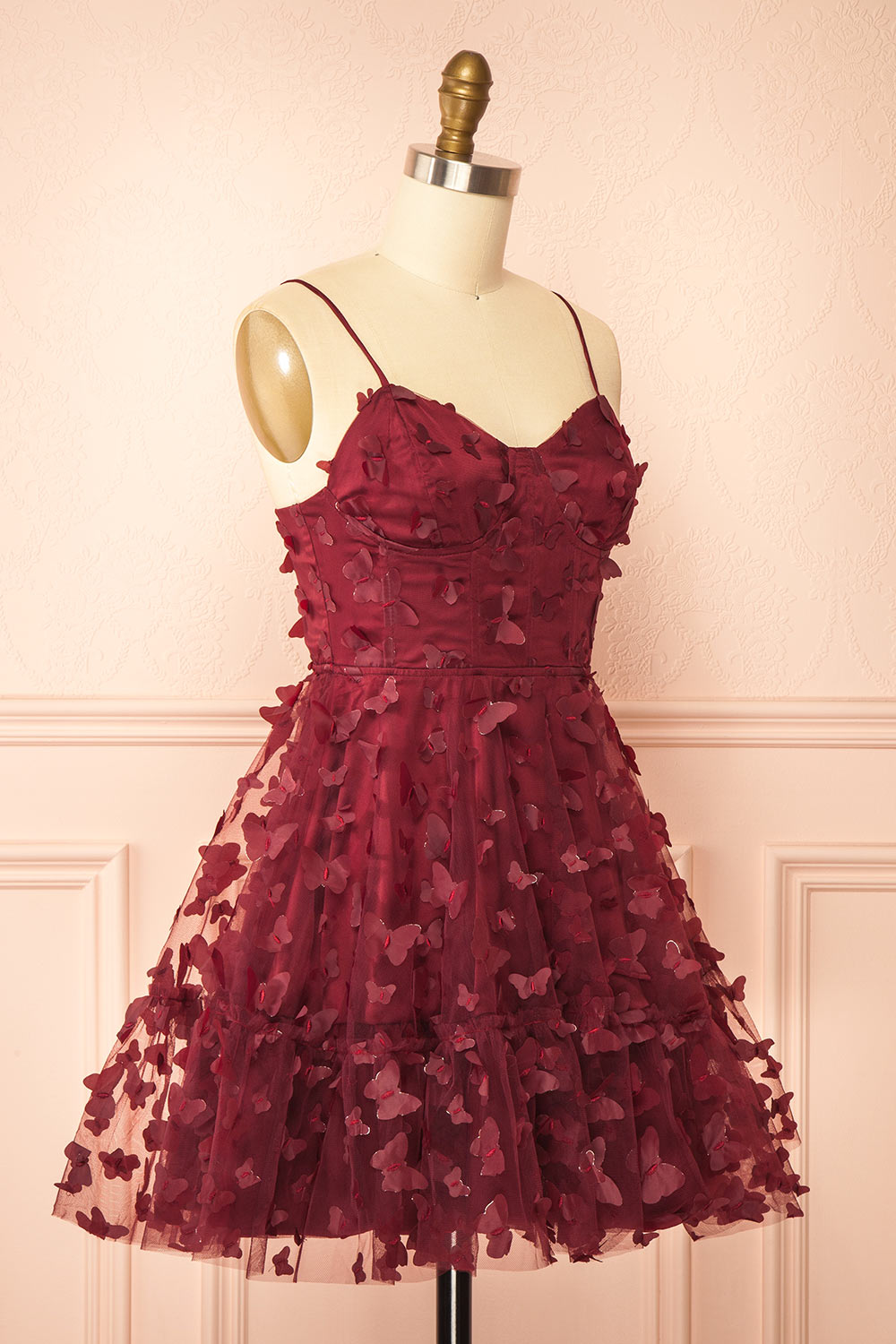 side view of a sewing mannequin wearing Faya Burgundy Short Corset Dress with Butterflies from Boutique 1861