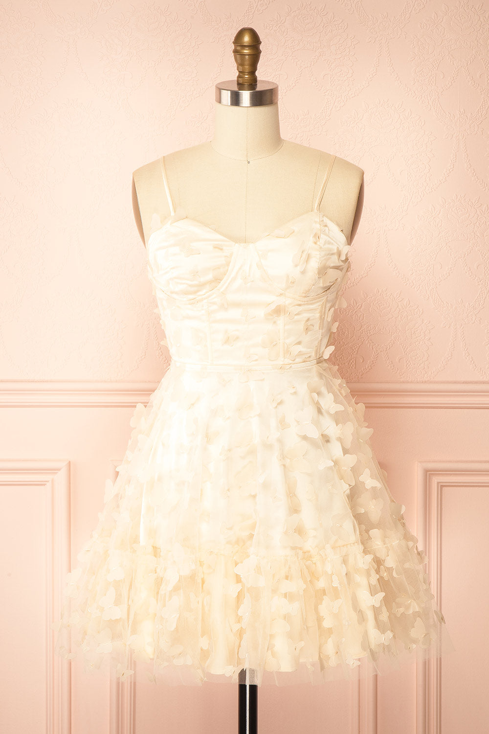front view of sewing Mannequin wearing Faya Ivory Short Corset Dress with Butterflies From Boutique 1861