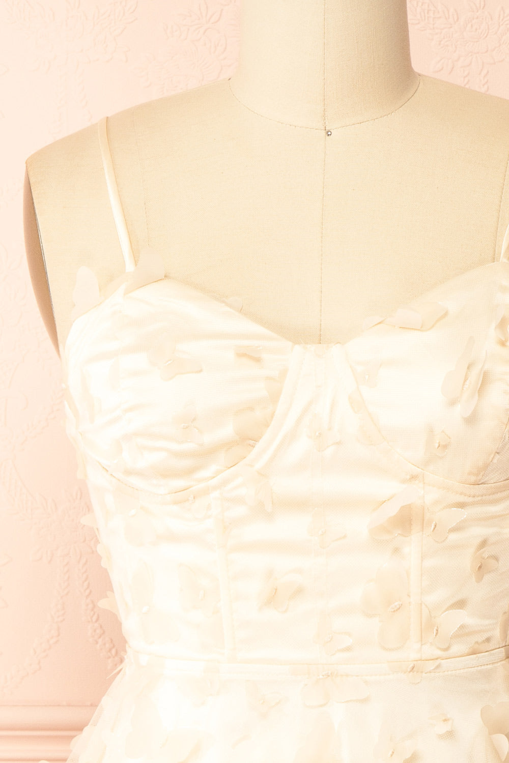 front of sewing Mannequin wearing Faya Ivory Short Corset Dress with Butterflies From Boutique 1861