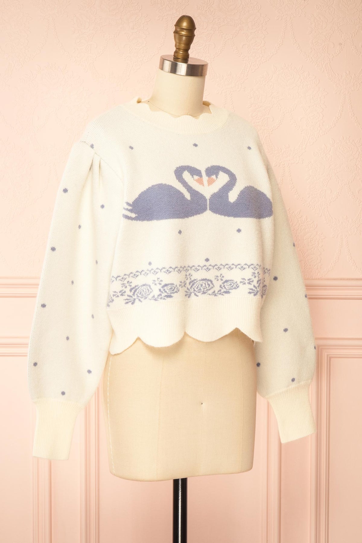 side view of Fidelka Ivory Swan Graphic Knit Sweater with Scalloped Trim at Boutique 1861