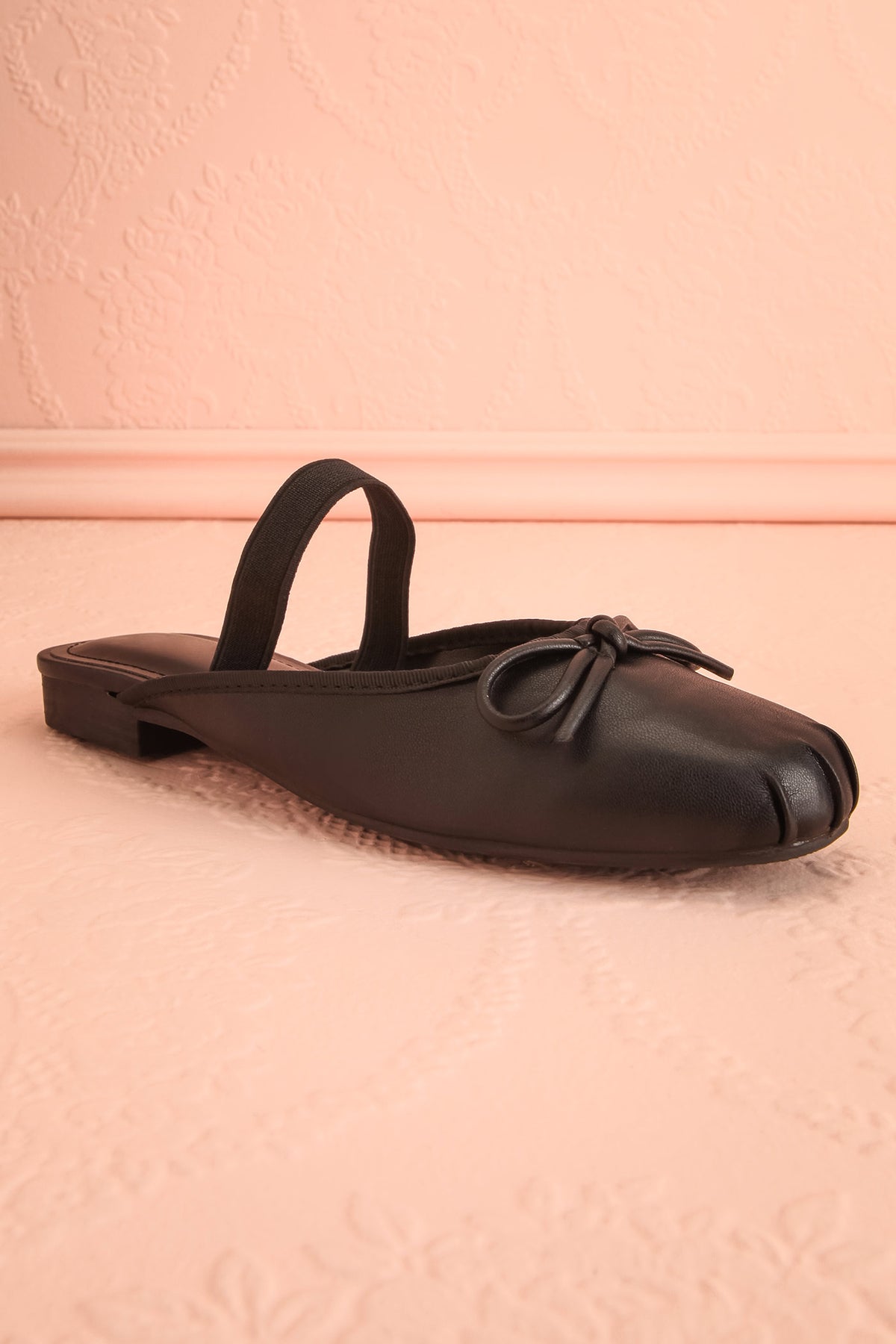 front view of Finnian Black Ballet Mule Flats at Boutique 1861