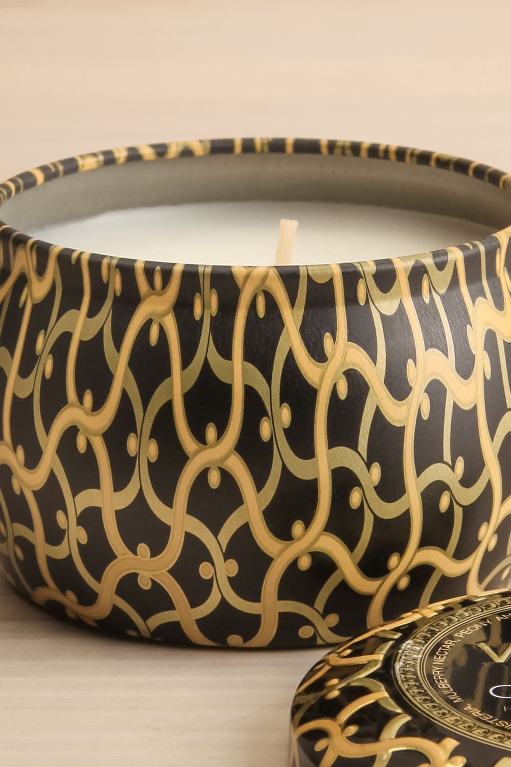 Freesia Clementine Mini Tin Candle by Voluspa | Maison garçonne open close-up