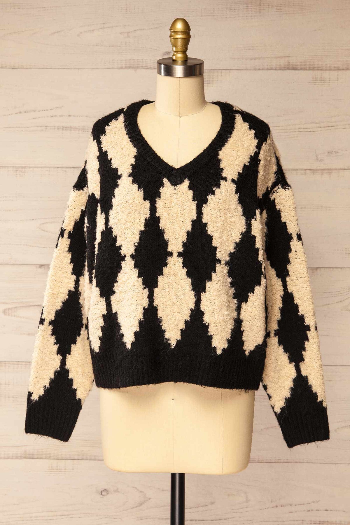 front view of Gawler Black Oversized Argyle V-Neck Knit Sweater at La petite garçonne