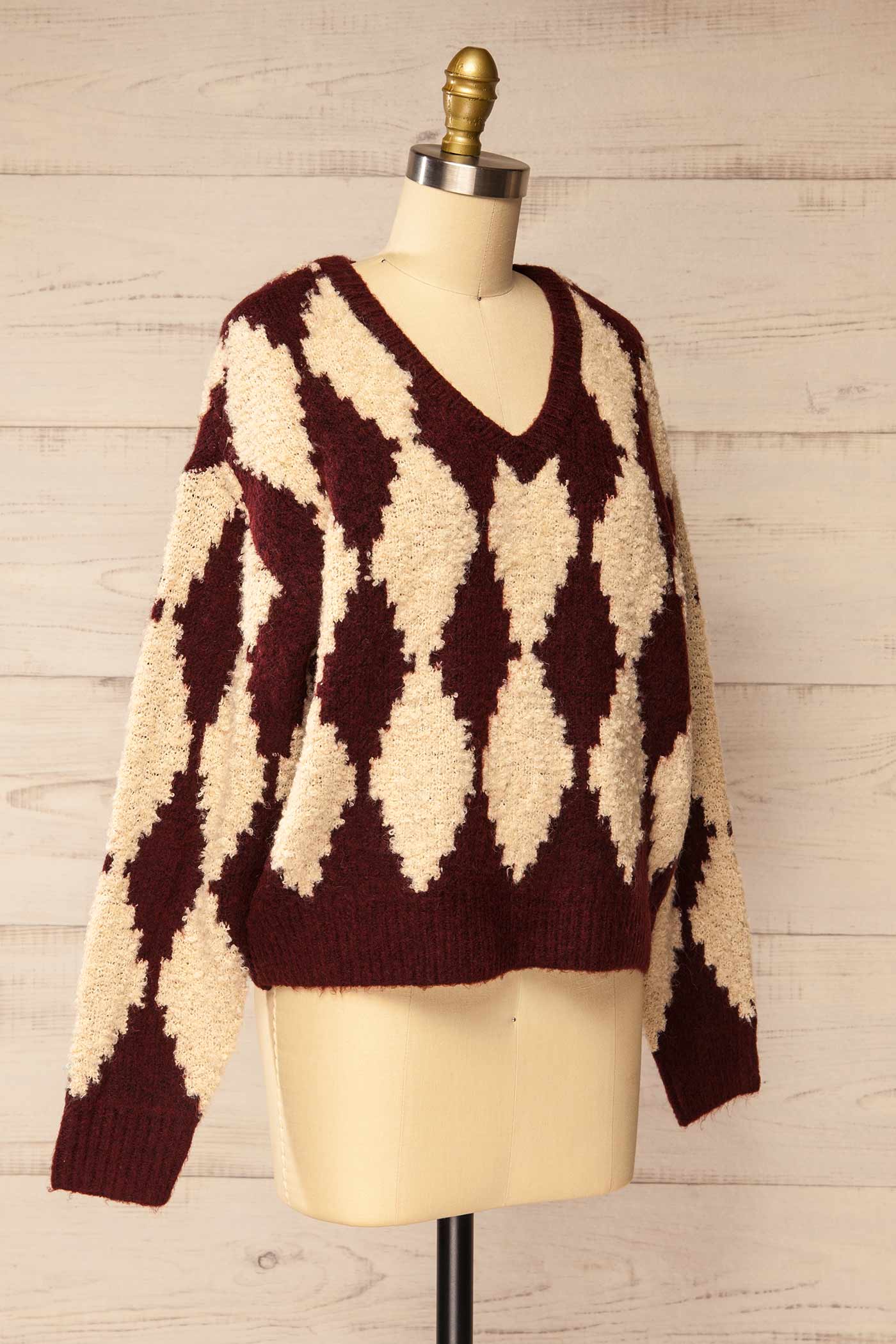 side view of Gawler Burgundy Oversized Argyle V-Neck Knit Sweater at La petite garçonne