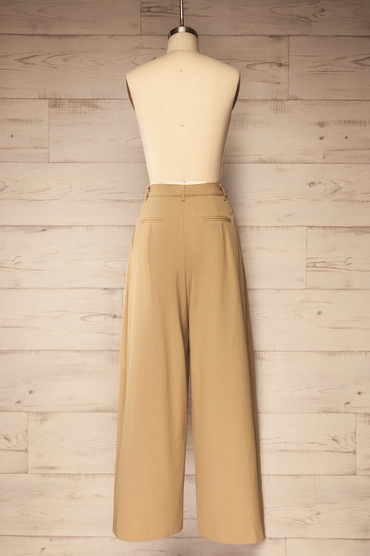 back view of Geraldton Beige High-Waisted Pleated Wide-Leg Pants at La petite garçonne