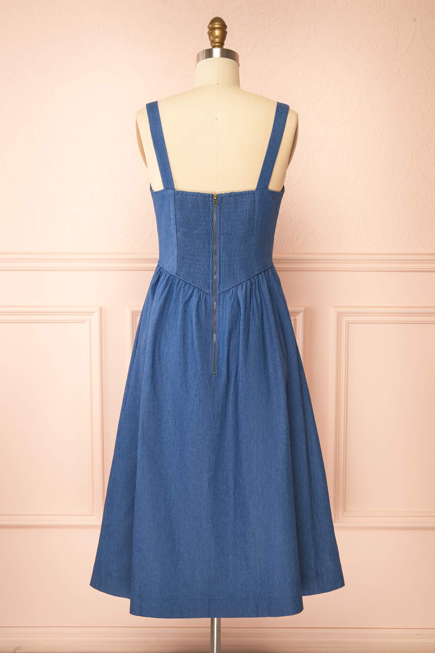 Backview of Gerogene Blue Denim Midi Dress with Bow and Smocked Back at boutique 1861