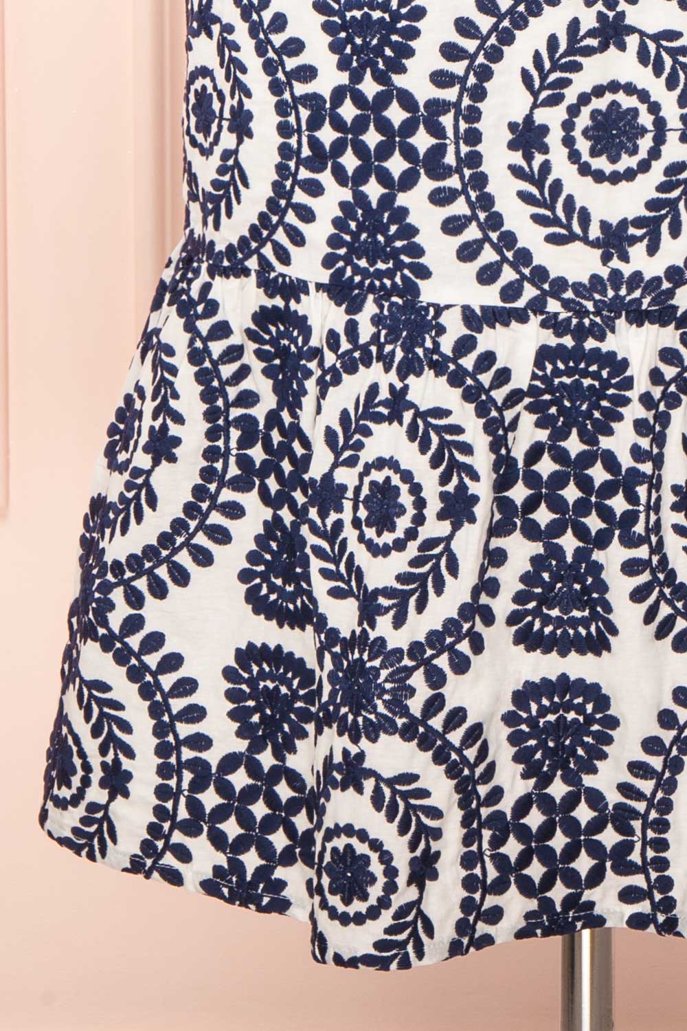 Gisa White Midi Dress w/ Navy Floral Embroidery | Boutique 1861 bottom close-up