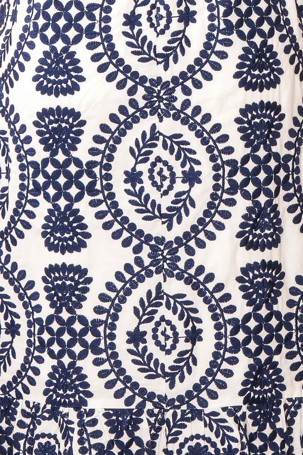 Gisa White Midi Dress w/ Navy Floral Embroidery | Boutique 1861 texture